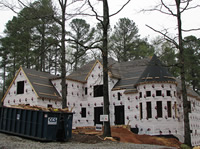 The house wrap is done.  Windows and doors go in next week.