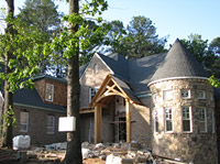 The brick and stone veneer is being installed.