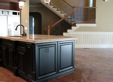 Looking from the kitchen island to the stairs.