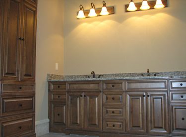 Custom vanity and linen cabinets in the master bath.