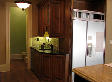 The wet bar with wine refrigerator.