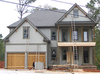 The roof brackets are on and the porch are progressing.