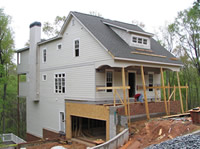 The siding is on and the brick work is in progress.
