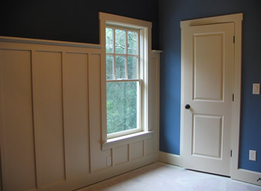 Custom wall treatment in the front secondary bedrooms.